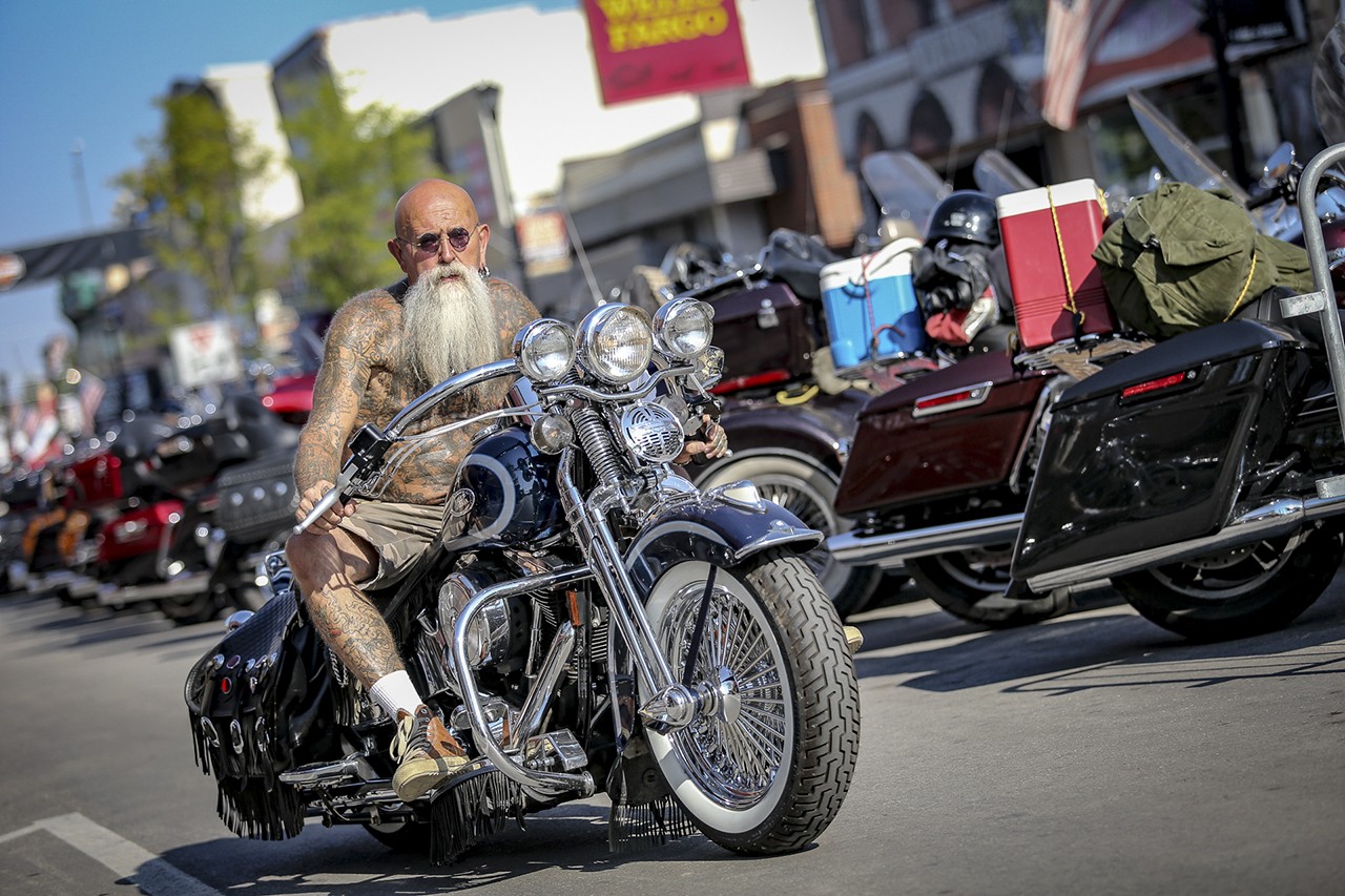 Man riding through downtown Sturgis